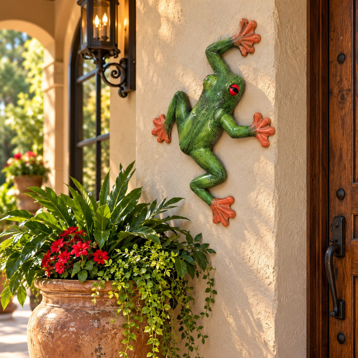 Green tree frog statue with red eyes and orange feet, cast aluminum garden decor