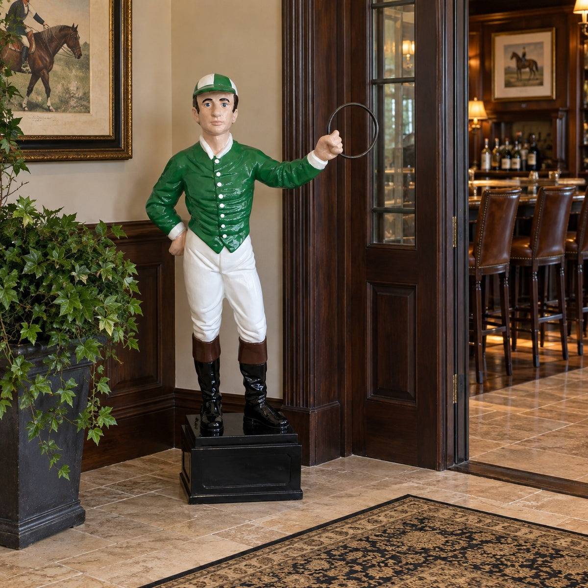 A cast aluminum jockey in green and white outside a western themed bar.