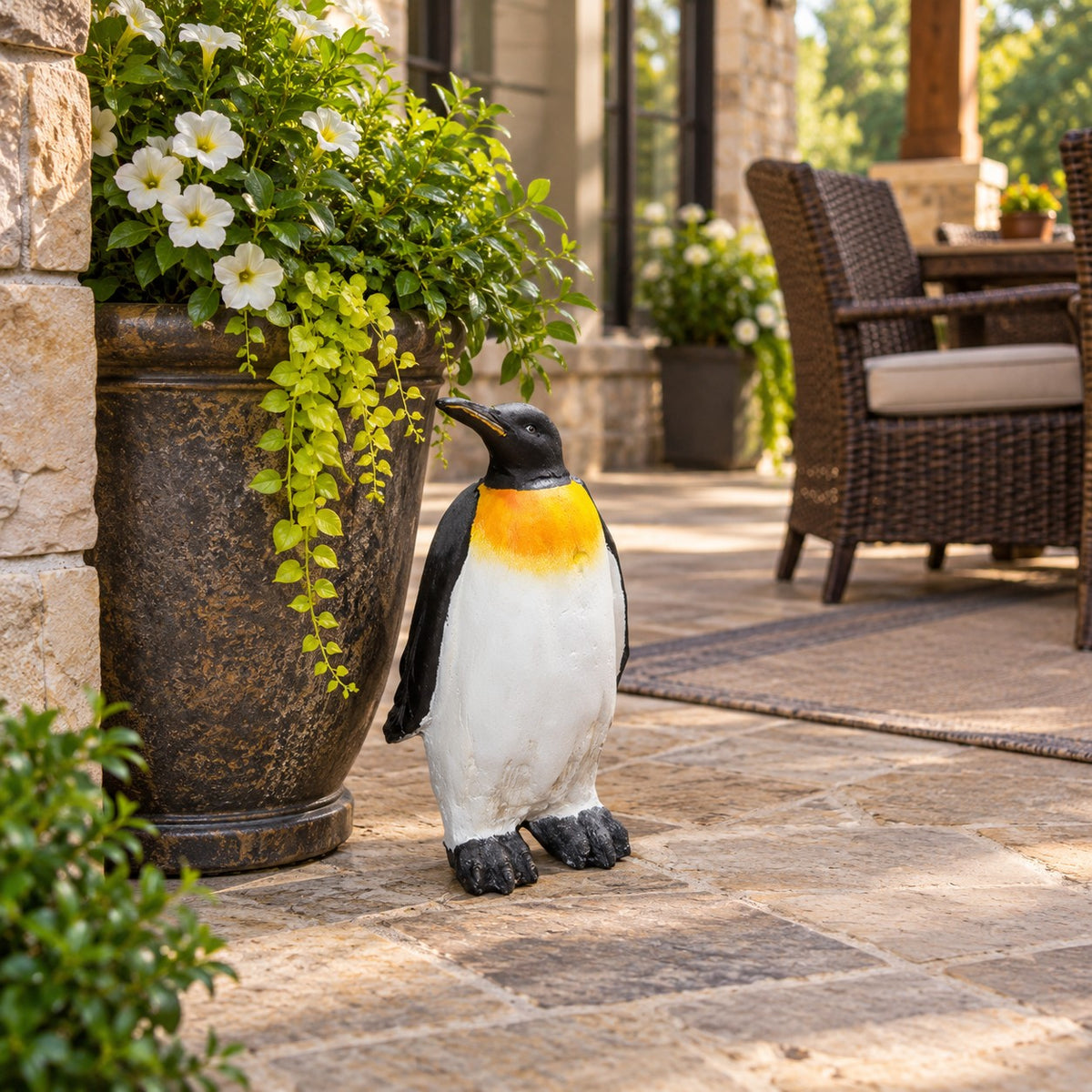 Cast aluminum penguin statue for yard or home decor, featuring black, white, and orange details