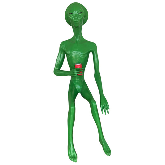 Green alien statue holding red can, cast aluminum yard decor for home or garden