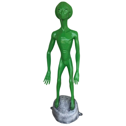 Green alien statue on rock base, cast aluminum yard decor for outdoor spaces