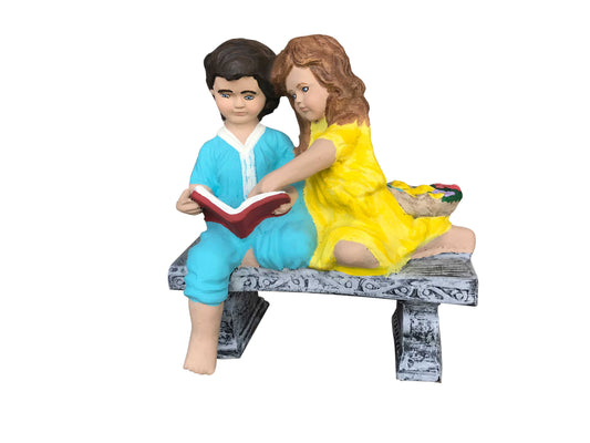 Boy and Girl Reading on Bench