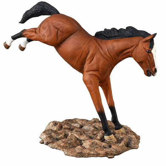 Cast aluminum bucking horse statue on rock base for residential/commercial decor areas.