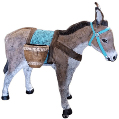 Cast aluminum donkey statue with basket and turquoise saddle, ideal for yard or home decor