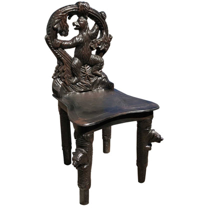 Cast aluminum bear chair with intricate woodland design for outdoor or indoor decor