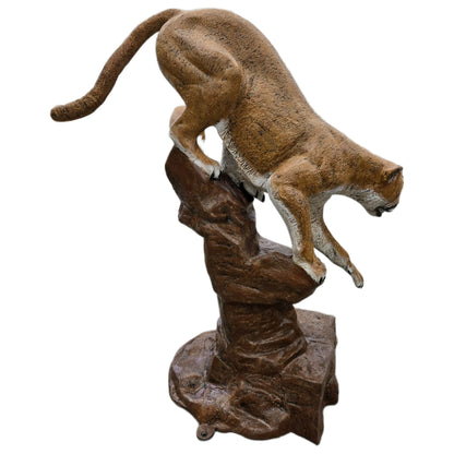 Cast aluminum cougar statue perched on rock, perfect for yard or home decor with lifelike detail.