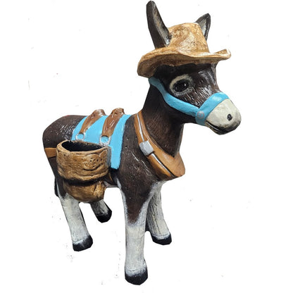 Cast aluminum donkey statue with cowboy hat, blue harness, and saddlebags for yard or home decor