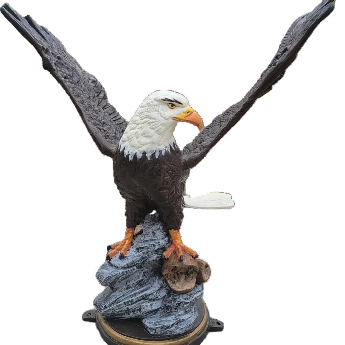 Cast aluminum bald eagle statue with wings spread, perched on rock base for yard or home decor
