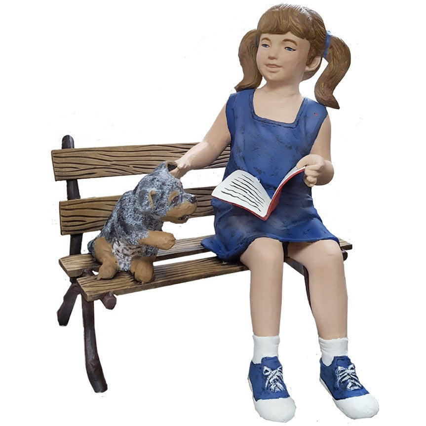 Girl reading book with dog on bench, cast aluminum garden statue for yard decor