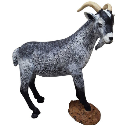 Cast aluminum ram statue with curved horns, textured gray coat, standing on rock base for yard decor