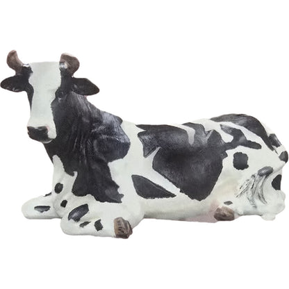 Black and white cow statue lying down, cast aluminum garden decor for backyard or yard