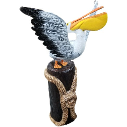Cast aluminum pelican statue perched on rope-wrapped post, outdoor yard decor