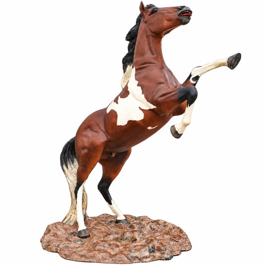 A cast aluminum 8-foot rearing mustang statue on a rock base for residential or commercial design spaces.