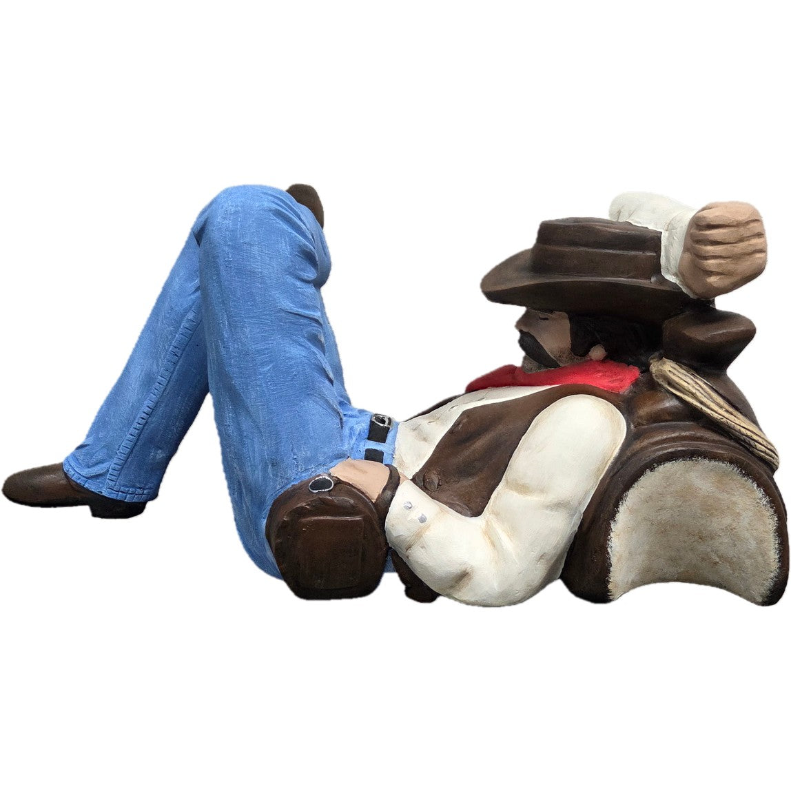 Relaxing cowboy statue in blue jeans, hat, and vest for yard or home decor