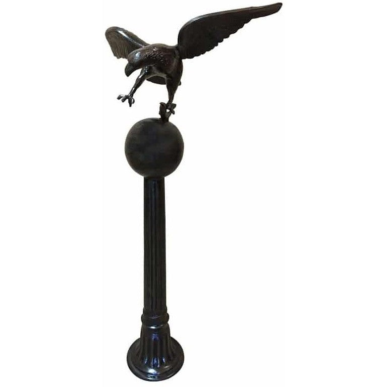 Cast aluminum eagle statue perched on pedestal for yard or home decor