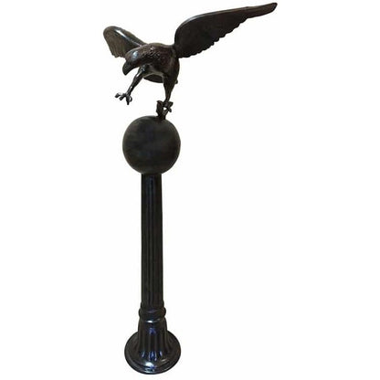 Cast aluminum eagle statue perched on pedestal for yard or home decor