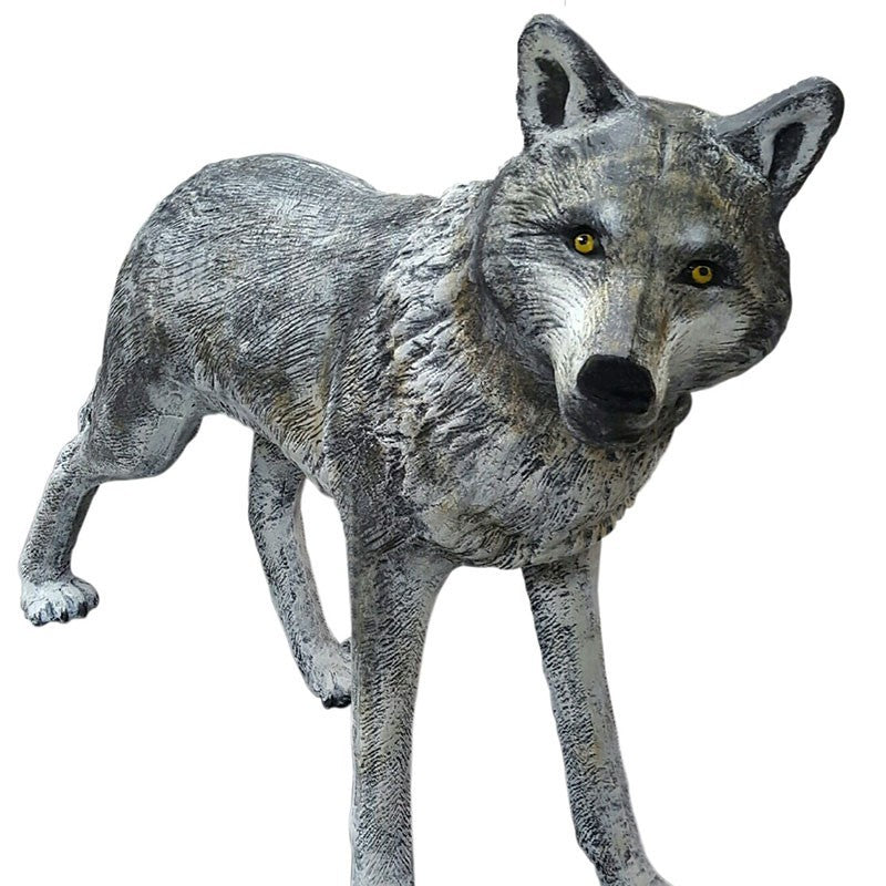 Cast aluminum wolf statue with detailed fur and yellow eyes, perfect for yard or home decor