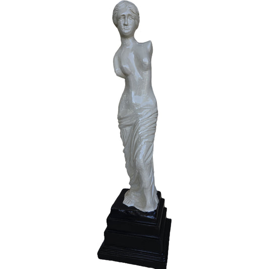 White cast aluminum statue of draped female figure on black pedestal for yard or home decor
