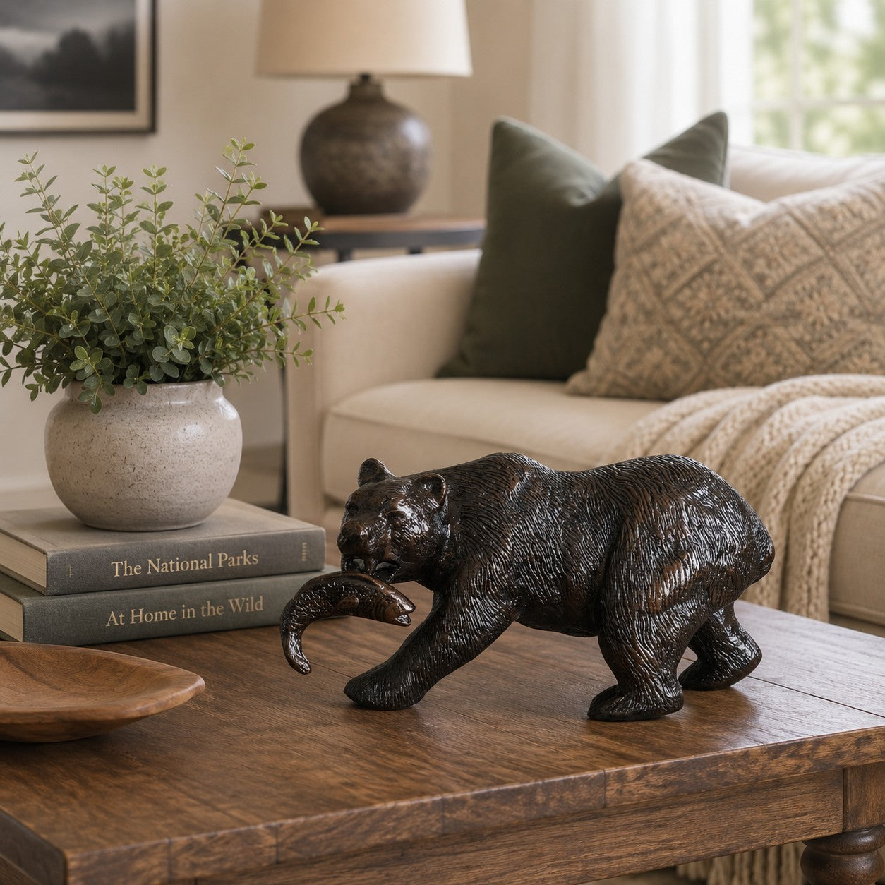 Cast aluminum bear statue holding fish, indoor home decor with detailed fur texture