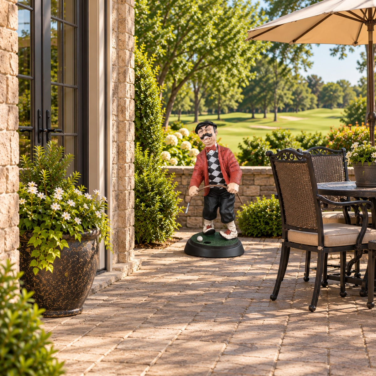 Cast aluminum angry golfer statue with mustache, red jacket, holding club on green base pictured on a patio