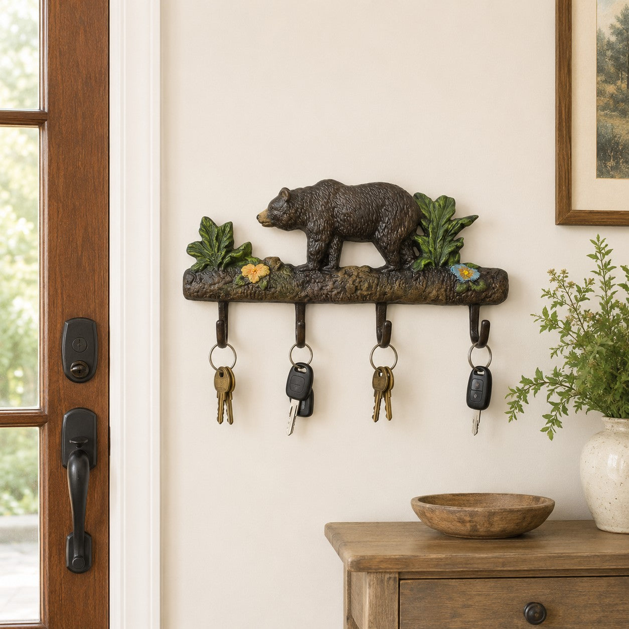 Cast aluminum bear wall hook with floral accents, rustic indoor or outdoor decor