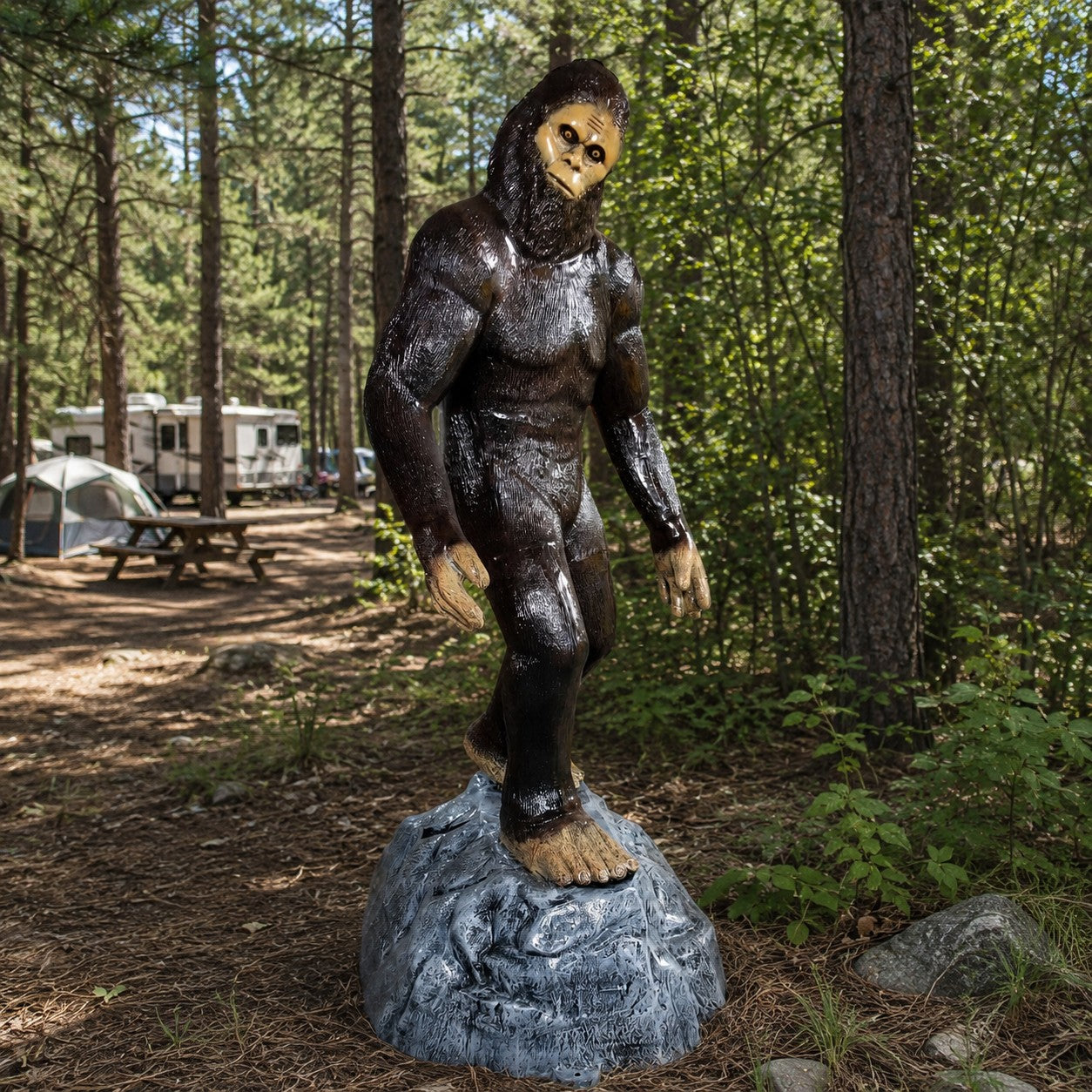 Cast aluminum Bigfoot statue for outdoor display, standing on rocky base