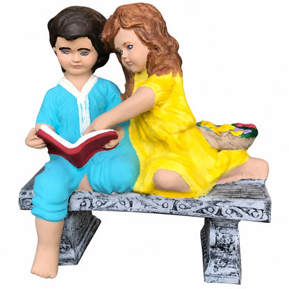 Cast aluminum children reading on bench for outdoor gardens