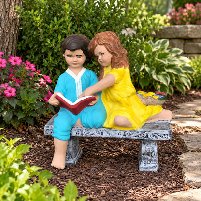 Cast aluminum children reading on bench for outdoor gardens