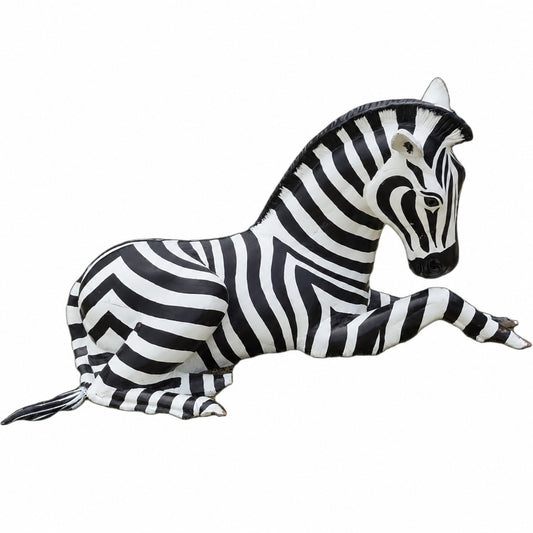 Cast aluminum zebra laying down for residential or commercial display or decor.