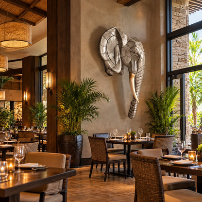 Cast aluminum elephant head statue with intricate design for indoor or outdoor use.