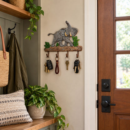 Cast aluminum elephant wall hook with green foliage, rustic finish, decorative home or yard accent