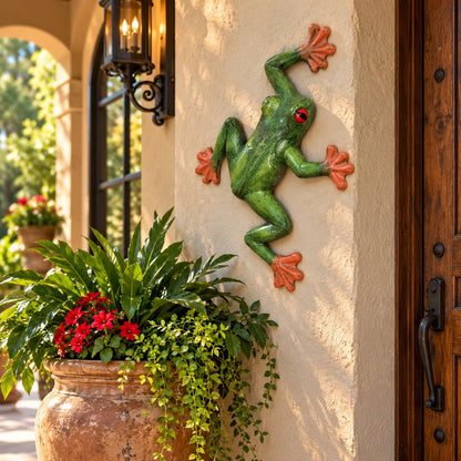 Green tree frog statue with red eyes and orange feet, cast aluminum garden decor