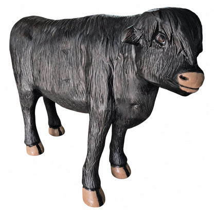Cast aluminum black highland cow without horns showing hair and realistic features