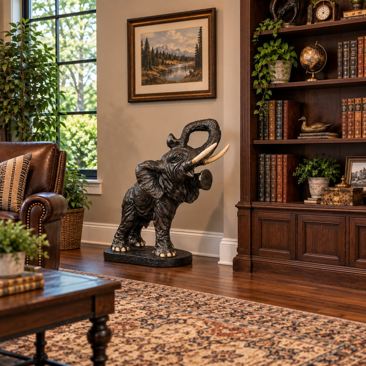 Cast aluminum elephant statue with raised trunk, perfect for yard or home decor