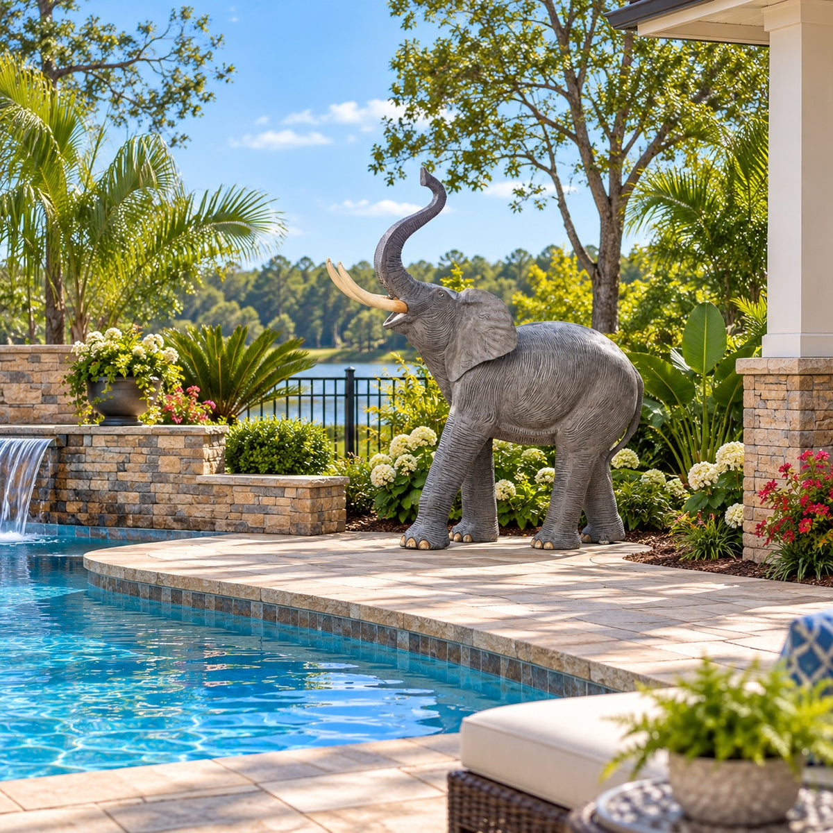 Cast aluminum elephant statue with raised trunk, ideal for yard or home decor