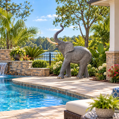 Cast aluminum elephant statue with raised trunk, ideal for yard or home decor
