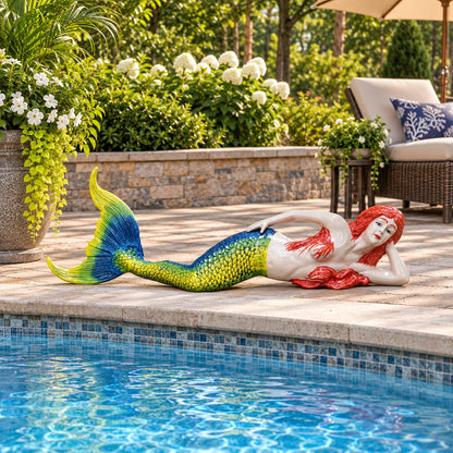Colorful mermaid statue with red hair and blue-green tail, perfect for garden or yard decor