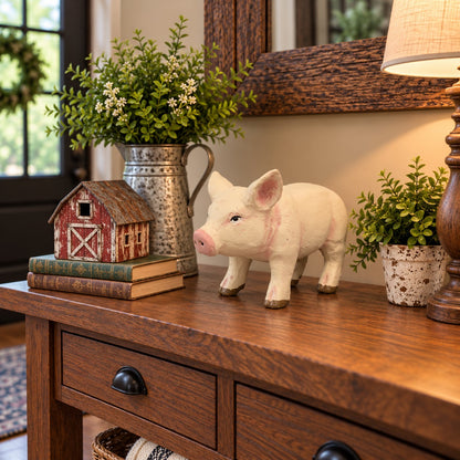 Cast aluminum pig statue with pink accents for garden or home decor