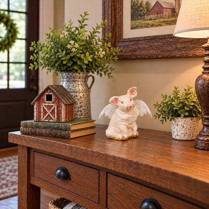 Cast aluminum sitting pig with wings for interior home design