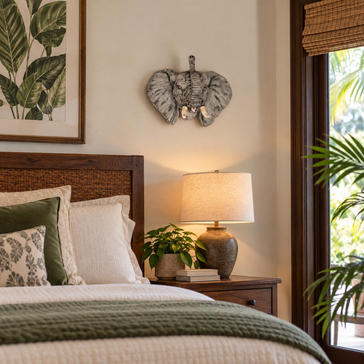 Cast aluminum small elephant head wall mount for indoor or outdoor use.