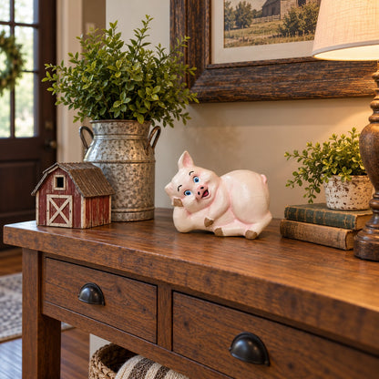 Cast aluminum small pig laying on its side with cute playful face for interior home decor