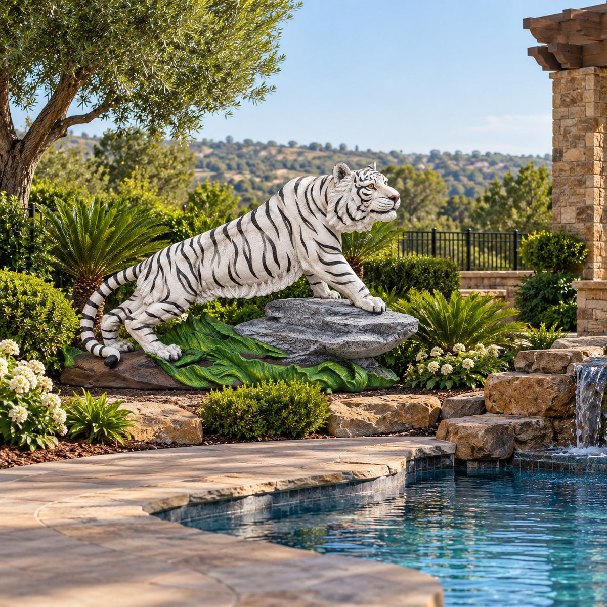 Large cast aluminum white tiger on rock for dramatic design spaces